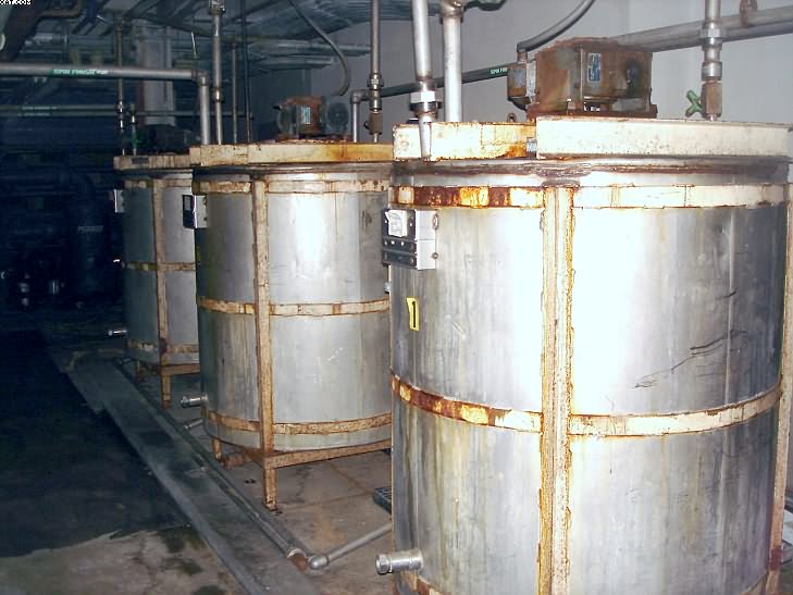 Stainless Steel Mix Tanks, with mixers.